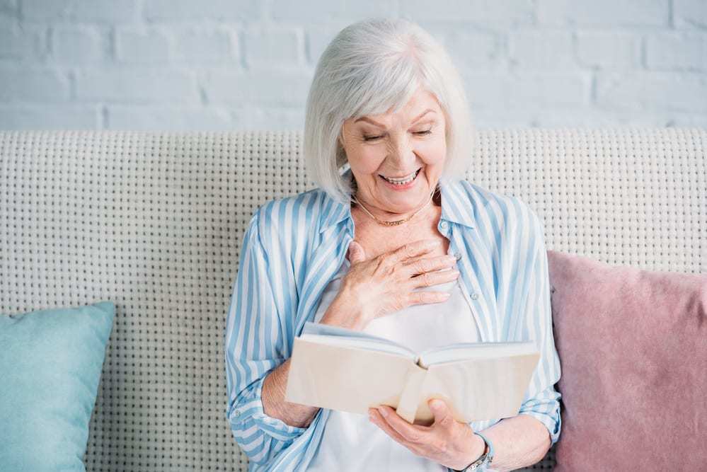 Senior-Woman-Reading-Smiling