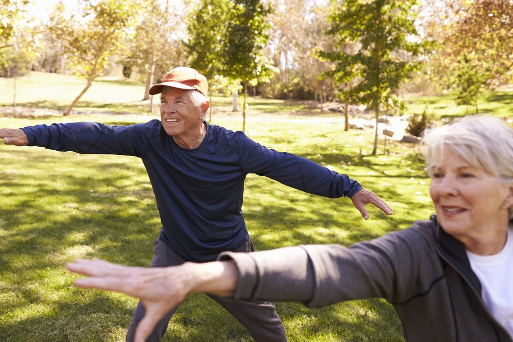 Two-seniors-doing-tai-chi-in-the-park