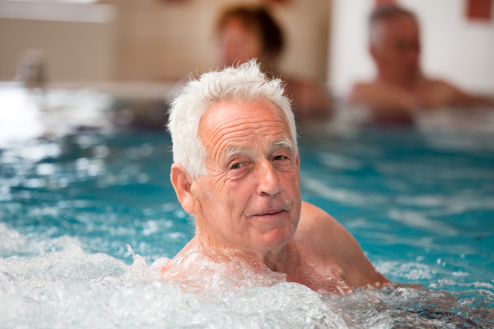 senior man in indoor pool